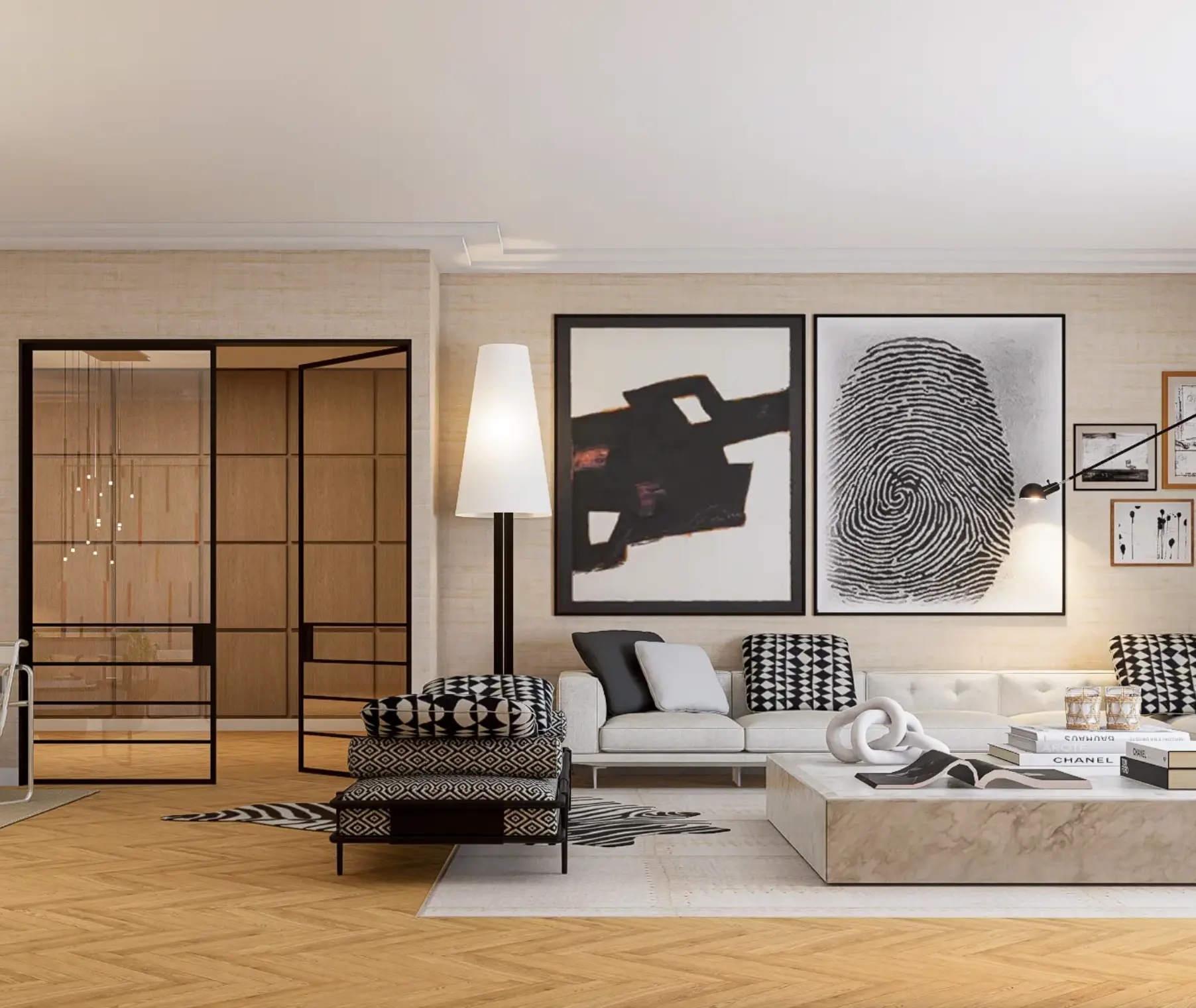 Zona de TV em que os quadros de grandes dimensões em tons de branco e preto são os protagonistas da decoração.