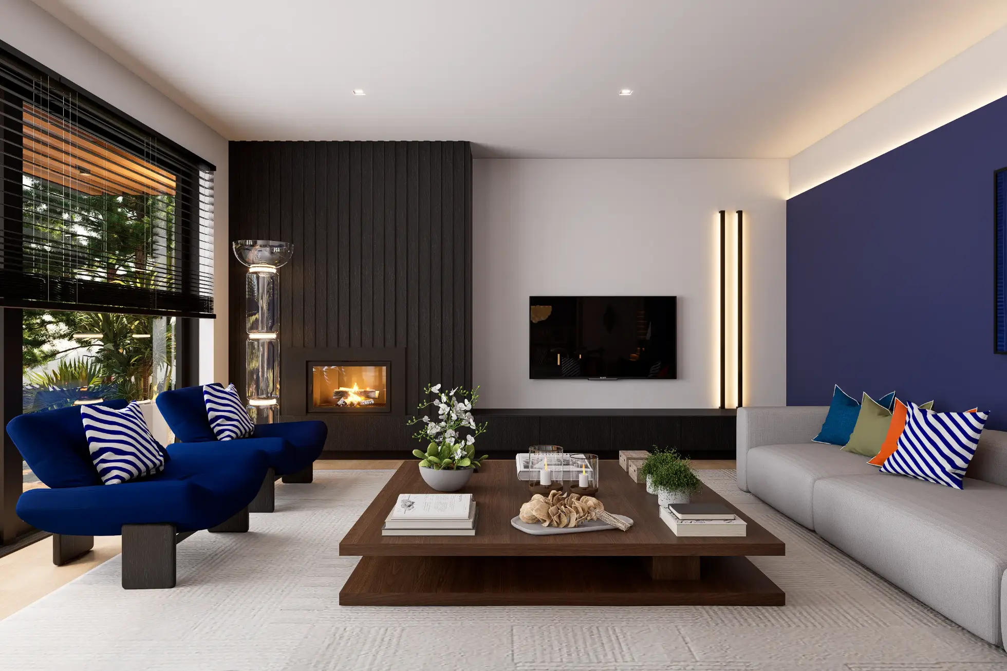 Living room with contemporary decor, a fireplace paneled in black wood, designer armchairs in blue, and a gray sofa with clean, straight lines