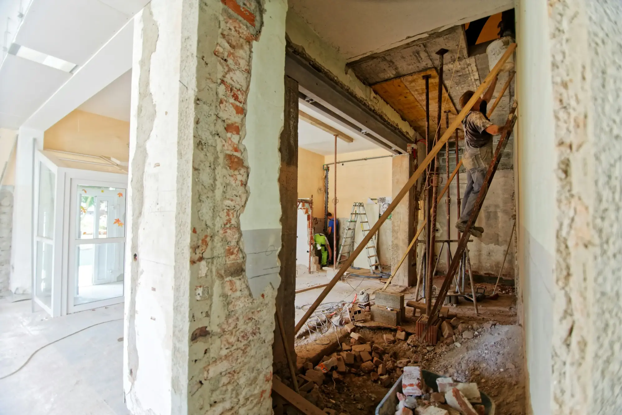 Renovation project for a house, with a construction crew performing demolition work