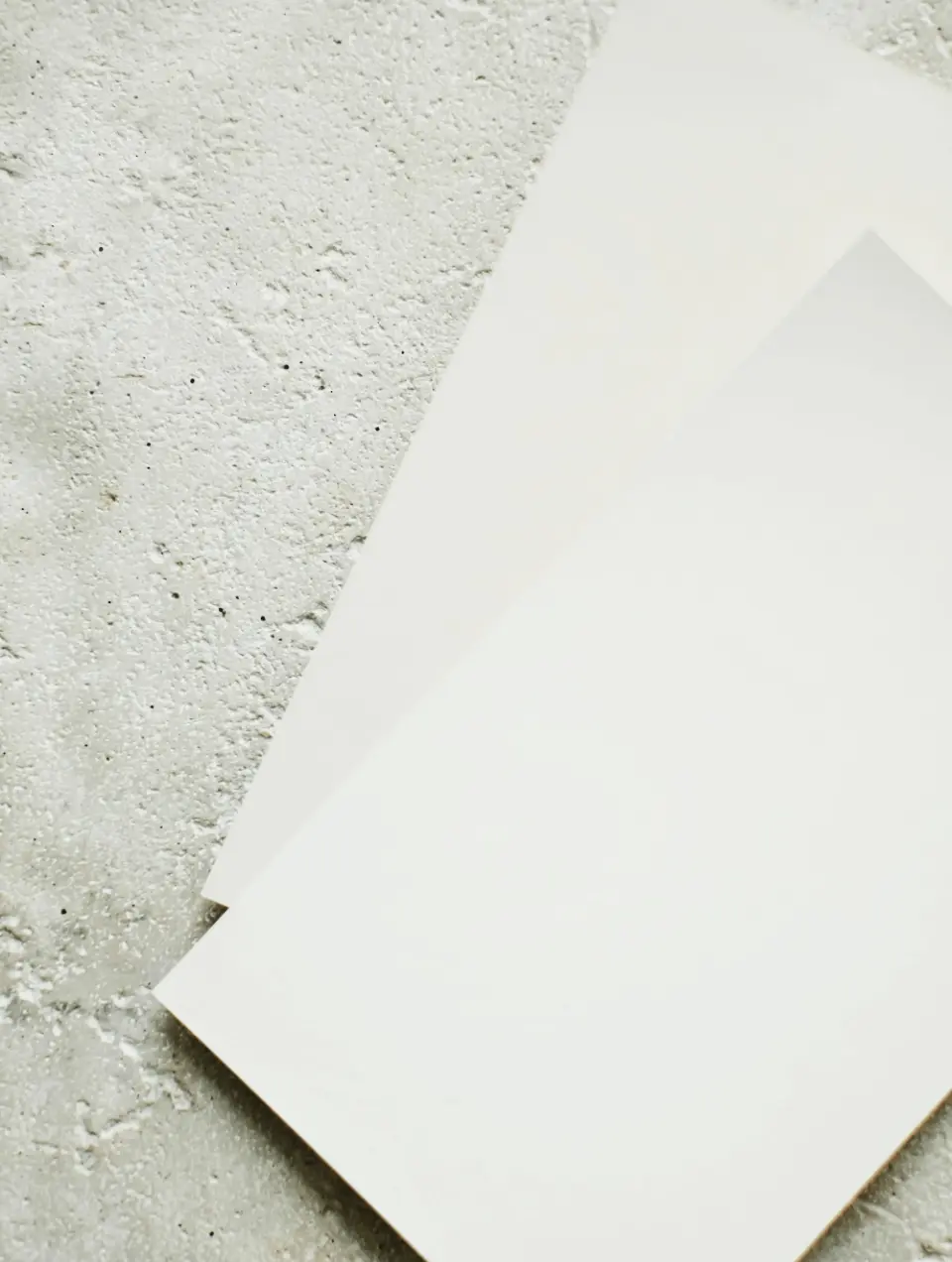 Color swatches in various shades of white to help choose wall paint for an interior design project