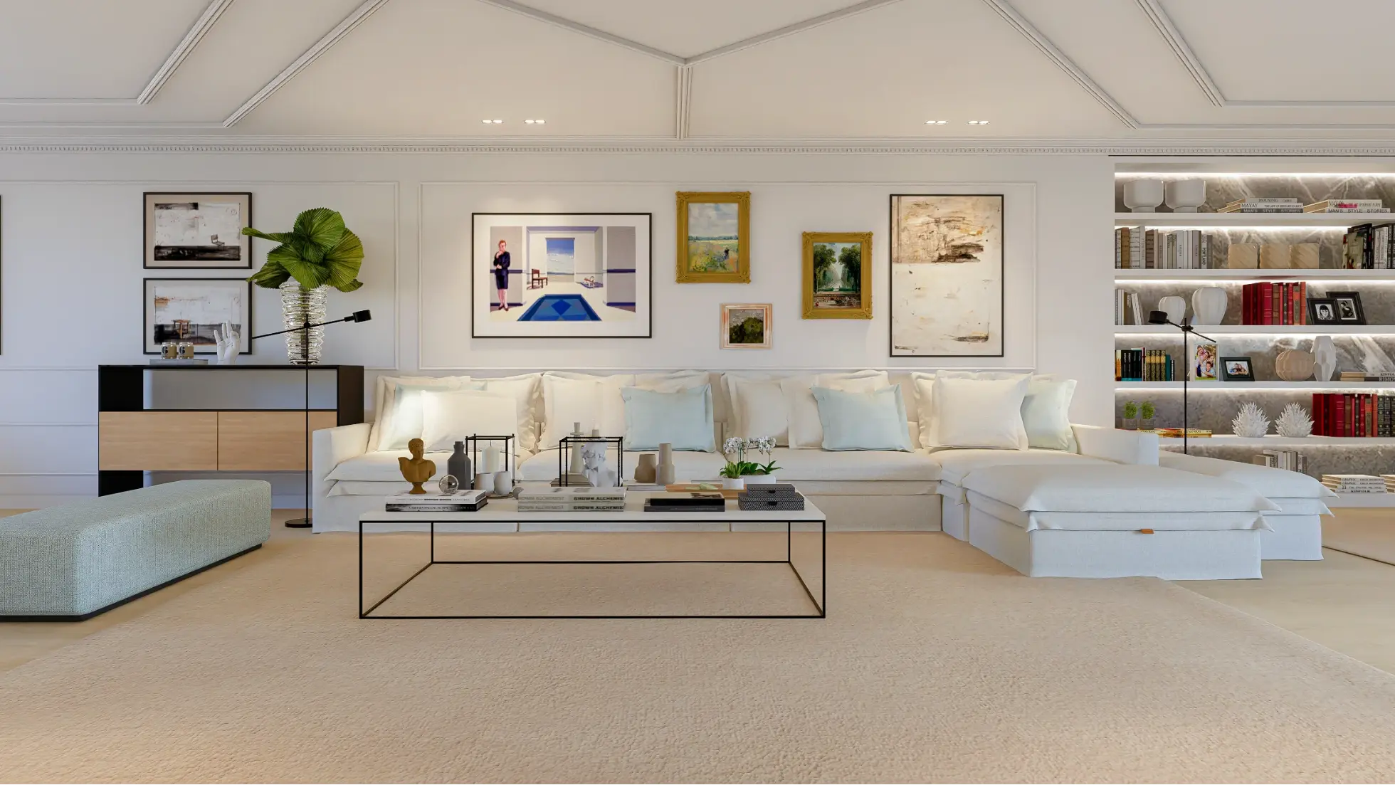 Living room seating area with a white slip-on sofa, ceilings decorated with mouldings, and a wall behind the sofa featuring a collection of various pi