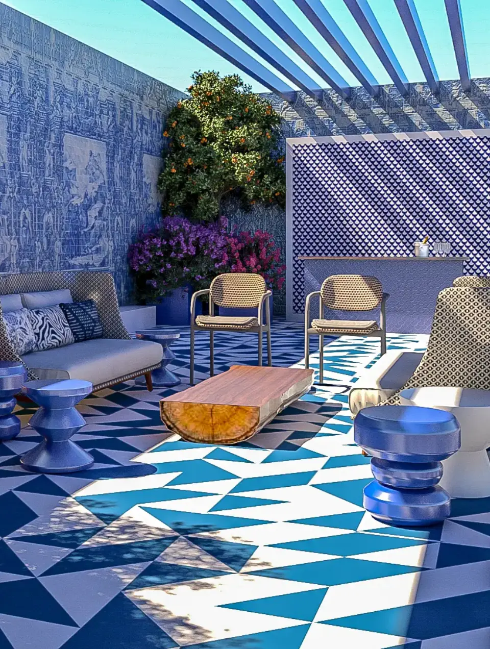 Outdoor hotel terrace with a bar, blue and white tile flooring, walls clad in traditional tiles, and rattan outdoor furniture