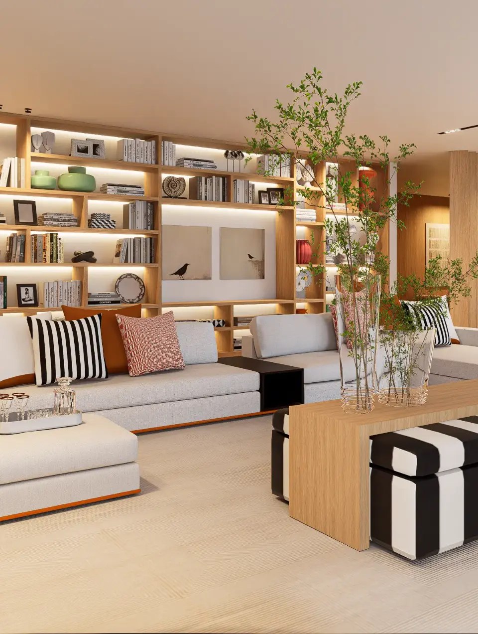 Spacious living room with white modular sofa, neutral-colored and striped cushions, black and white upholstered bench, bespoke bookcase