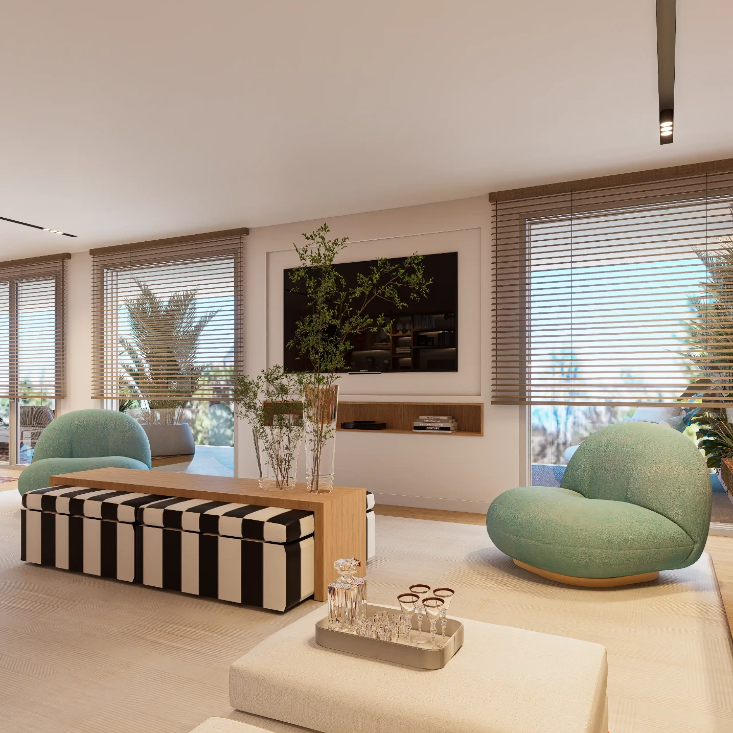 Large living room TV area with green armchairs, wall-mounted TV, black and white striped bench, wooden coffee table, and large windows.