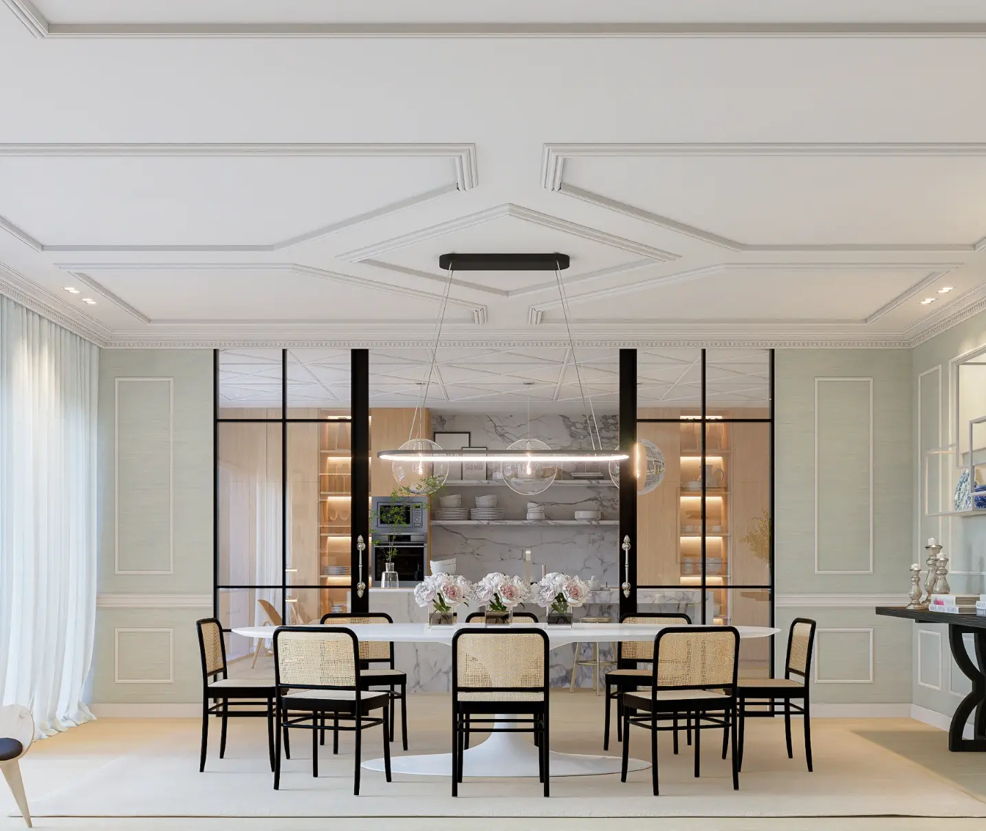 Dining room with white oval table, black straw chairs, modern oval lamp, black glass doors separating it from the kitchen 